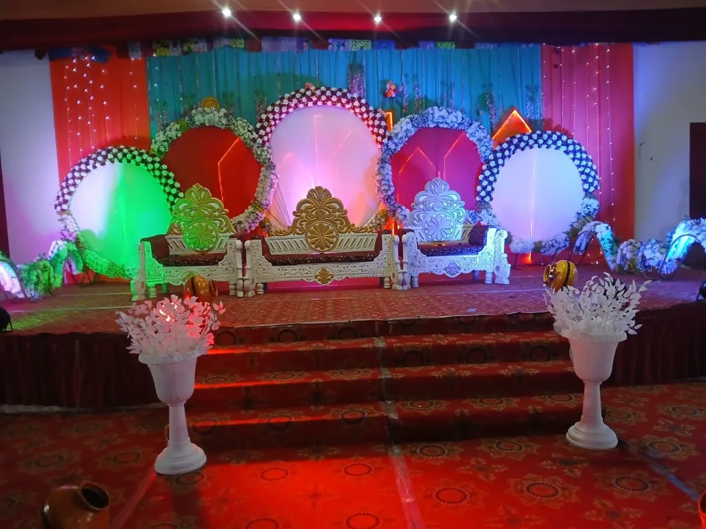 Lit Reception Stage with Floral Rings